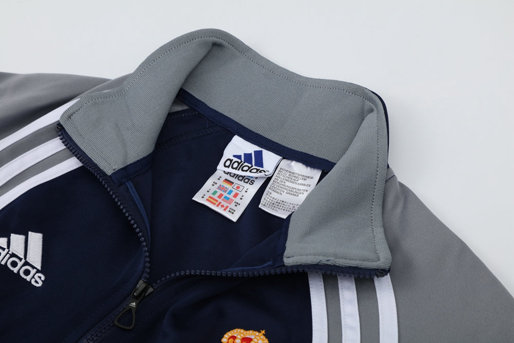 Ensemble de survêtement veste-pantalon Real Madrid Pre-Match bleu marine et gris