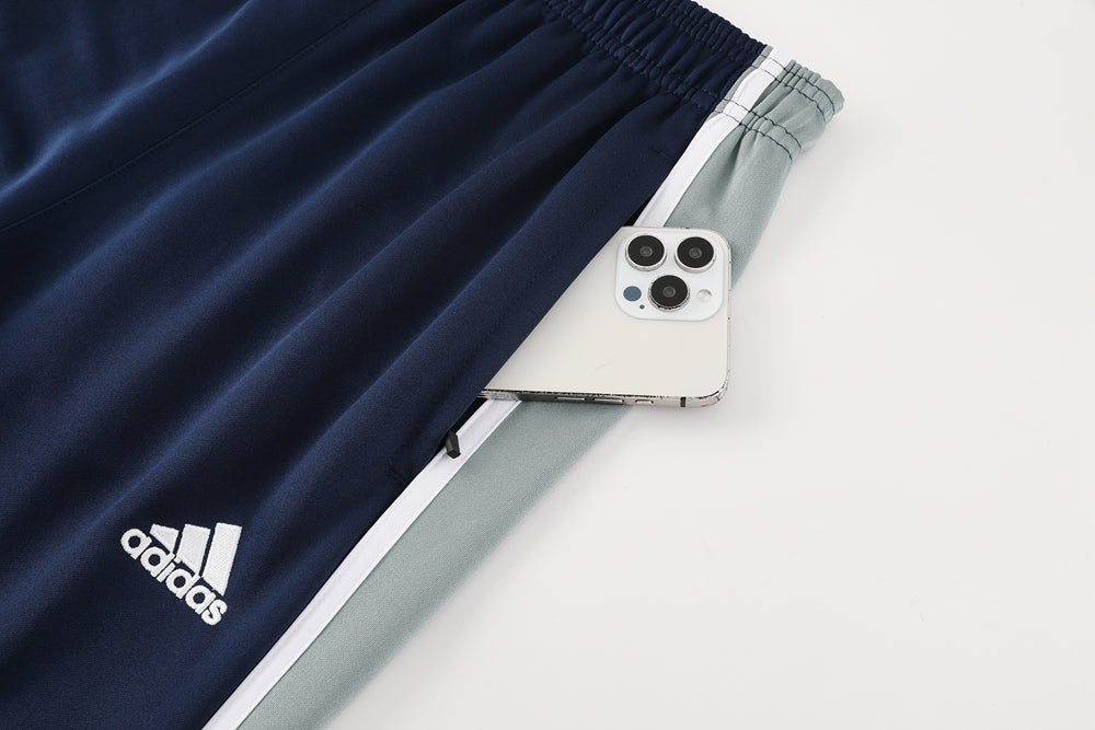 Ensemble de survêtement veste-pantalon Real Madrid Pre-Match bleu marine et gris